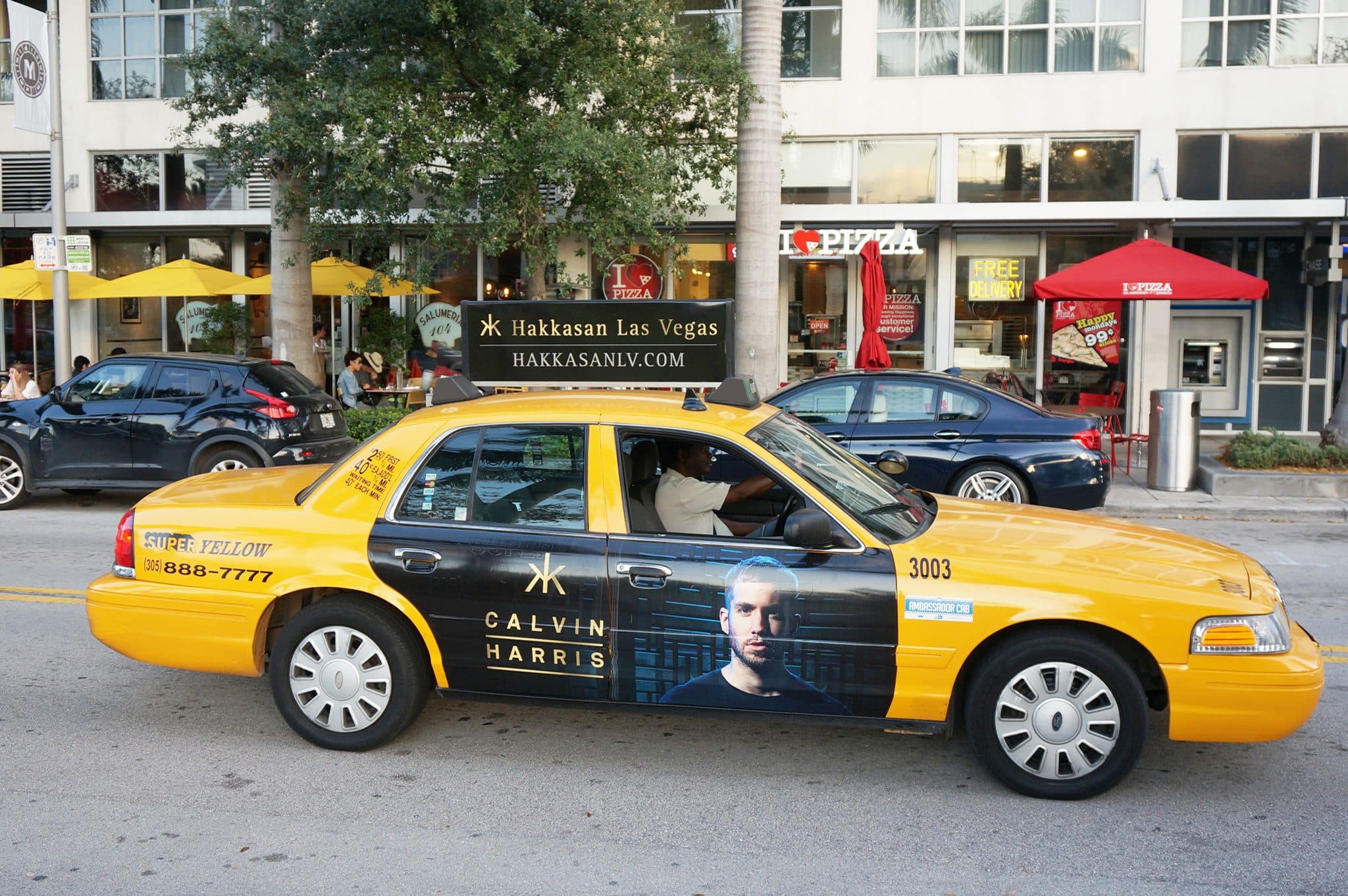 Hakkasan Las Vegas — Calvin Harris taxi door wrap in city traffic
