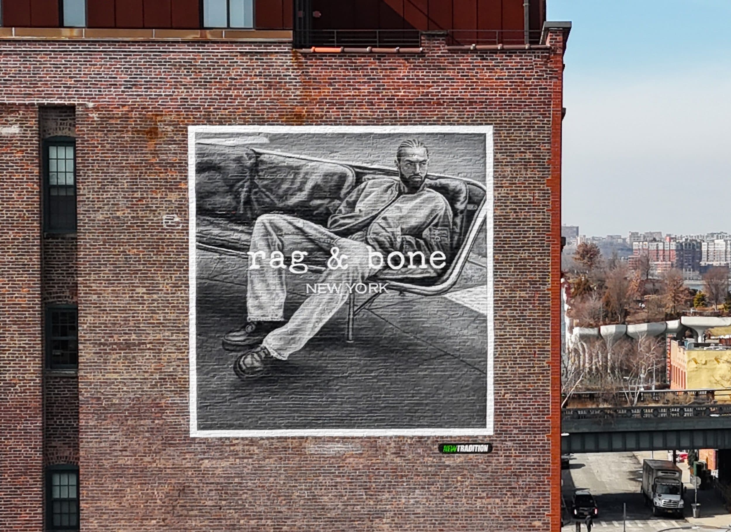 rag & bone — hand painted mural across a brick warehouse facade
